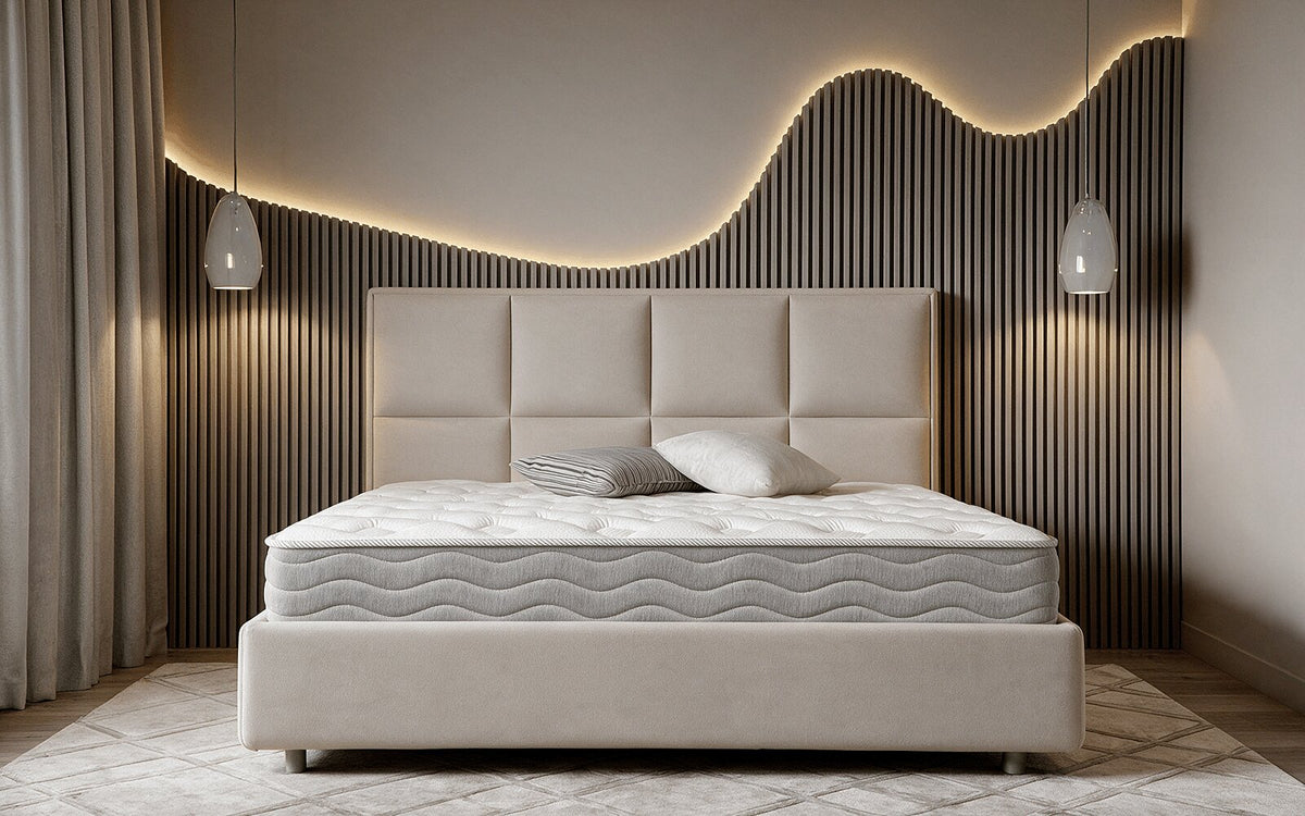 Interior lifestyle photo of the Exp Technology Flexy Spring mattress with knitted fabric and quilted detailing