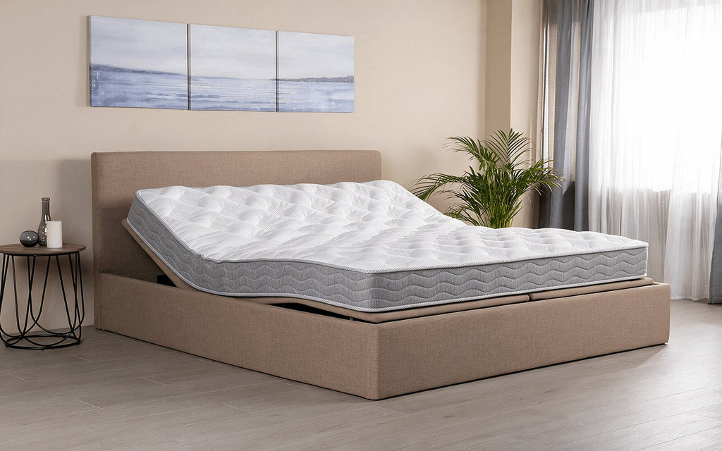 Interior lifestyle view of the Exp Technology Flexy Spring mattress with knitted fabric and quilted detailing
