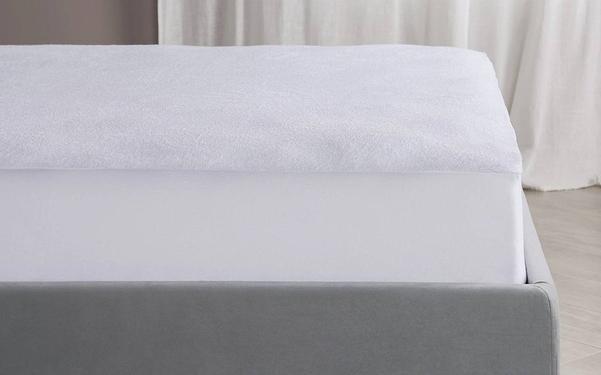 Terry mattress protector in a bedroom interior, view 1